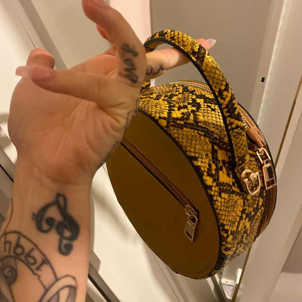 Small Mustard Faux Circle Cross bag .